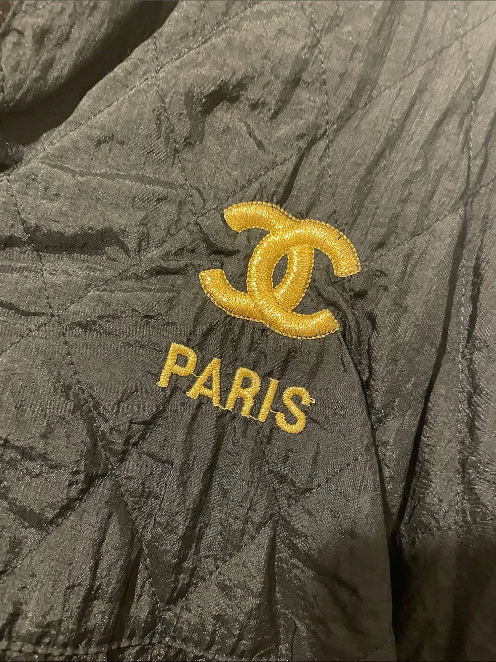 CHANEL Black Quilted Hooded Windbreaker with Gold Logo